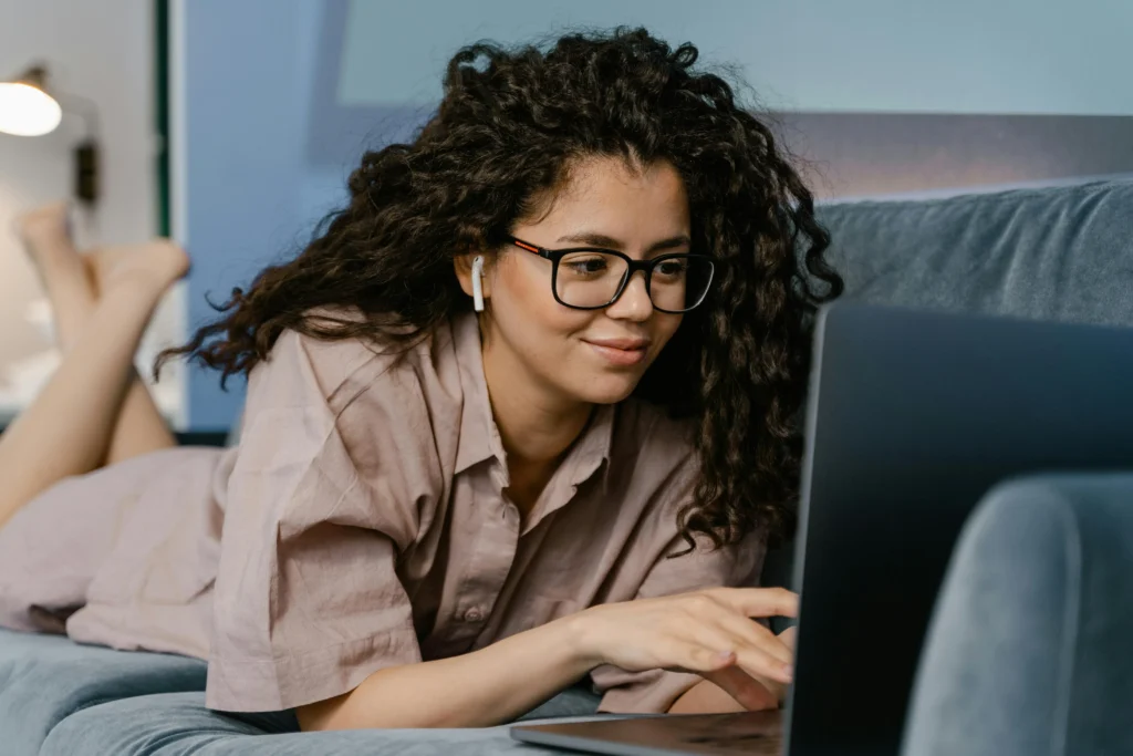 Person working remotely on a laptop in a home office setup representing remote tech jobs in 2025